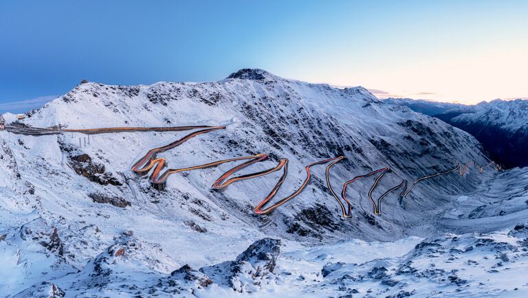 Car Trails Lights On Bends Of Stelvio Pass Mountain Road, South Tyrol, Italy